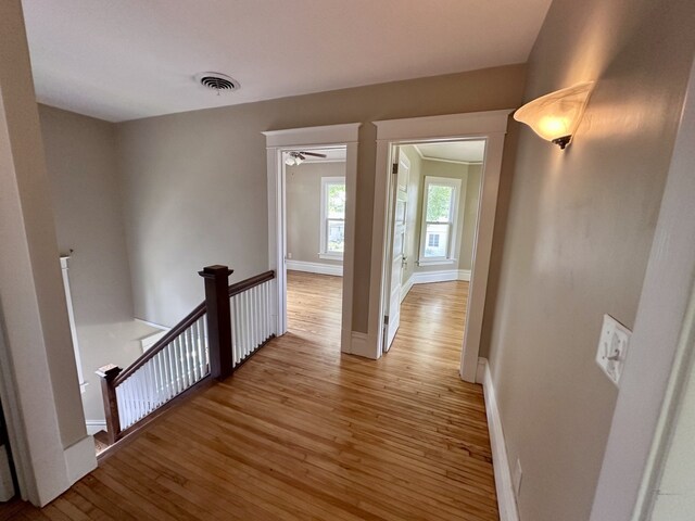 1527 7th St, Peru, IL 61354 - hall with an upstairs landing, light wood-style floors, and baseboards