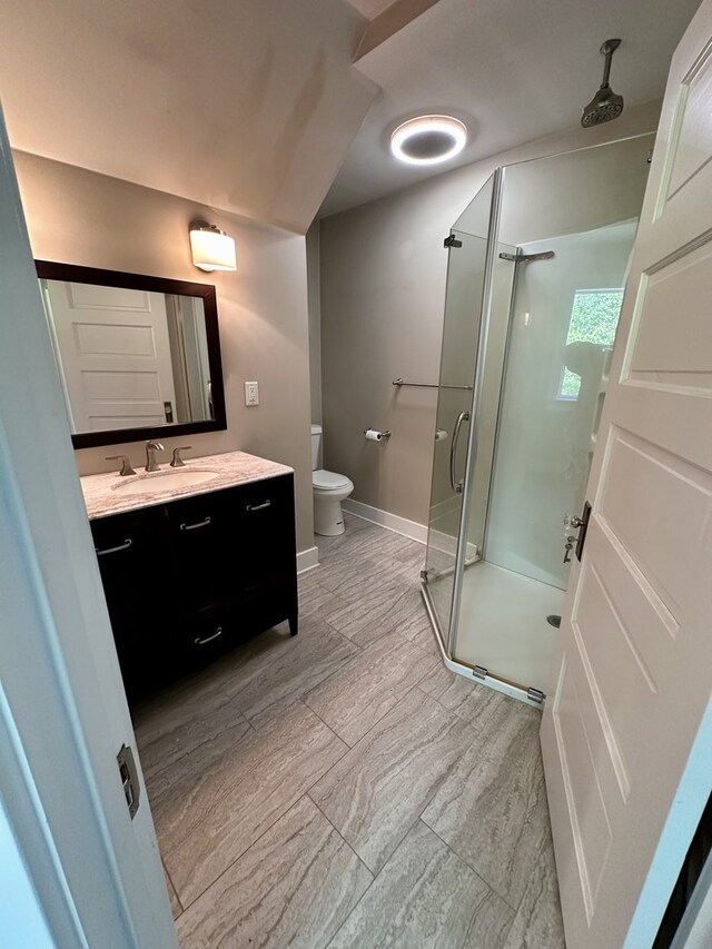 1527 7th St, Peru, IL 61354 - full bath with toilet, a shower stall, vanity, and baseboards