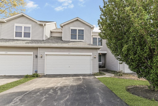 111 Woodland Cir, North Aurora, IL 60542 - view of front of house featuring driveway and an attached garage