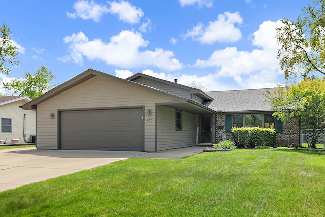 view of front of house with an attached garage, a front yard, concrete driveway, roof with shingles, and brick siding