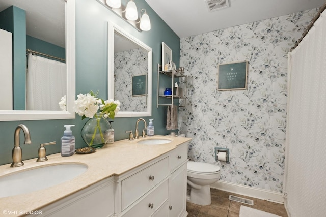229 Concord Ln Unit 229, Carol Stream, IL 60188 - full bathroom with toilet, double vanity, tile patterned floors, a shower with shower curtain, and baseboards