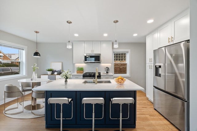3946 N Oleander Ave, Chicago, IL 60634 - kitchen with stainless steel appliances, white cabinetry, light countertops, and recessed lighting