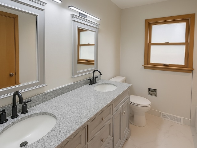 112 Burton Ave, Waukegan, IL 60085 - bathroom with toilet, double vanity, and baseboards