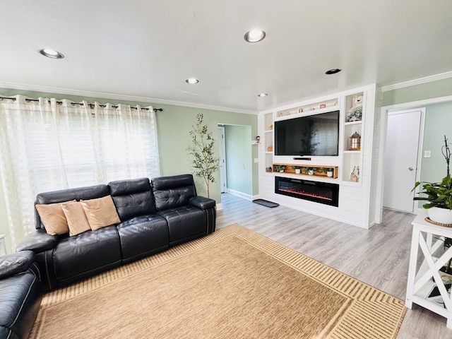 321 Lewis Ave, Wauconda, IL 60084 - living room with ornamental molding, wood finished floors, a glass covered fireplace, recessed lighting, and baseboards