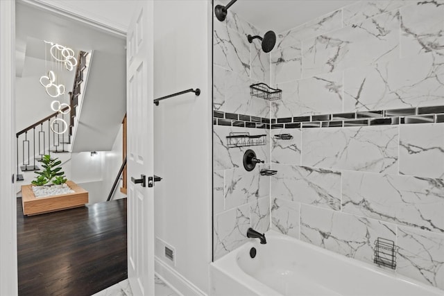 8241 S Aberdeen St, Chicago, IL 60620 - full bathroom with washtub / shower combination, a chandelier, marble finish flooring, and baseboards