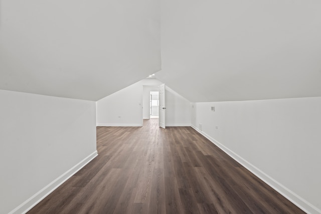 8241 S Aberdeen St, Chicago, IL 60620 - additional living space featuring baseboards, dark wood finished floors, and lofted ceiling