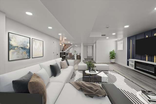 8241 S Aberdeen St, Chicago, IL 60620 - living room featuring stairway, recessed lighting, wood finished floors, baseboards, and a glass covered fireplace