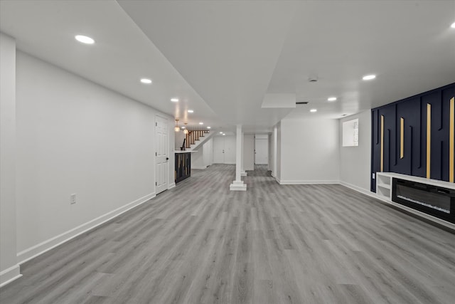 8241 S Aberdeen St, Chicago, IL 60620 - unfurnished living room featuring light wood-type flooring, stairway, baseboards, and recessed lighting