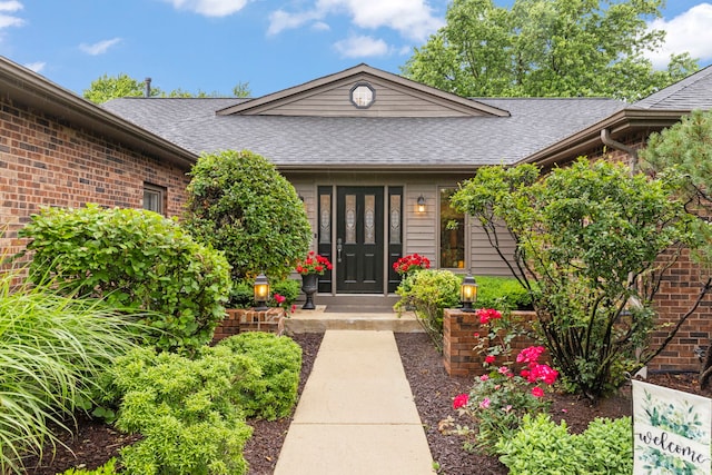 608 61st St, Lisle, IL 60532 - entrance to property featuring a shingled roof, brick siding, and french doors