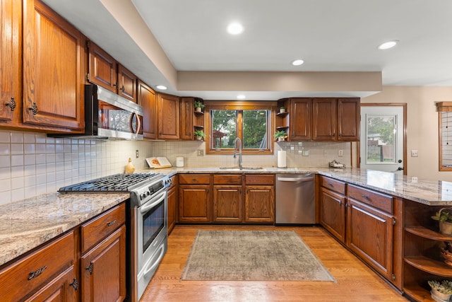 608 61st St, Lisle, IL 60532 - kitchen with open shelves, stainless steel appliances, a peninsula, light wood finished floors, and plenty of natural light