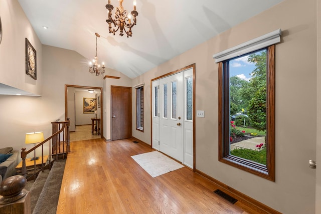 608 61st St, Lisle, IL 60532 - foyer with a chandelier, light wood finished floors, and vaulted ceiling