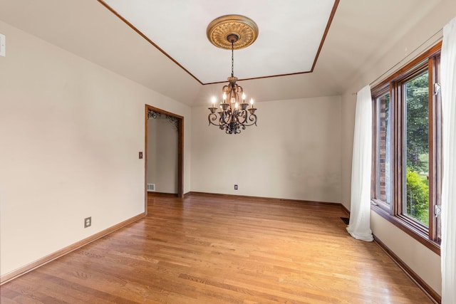 608 61st St, Lisle, IL 60532 - unfurnished room featuring healthy amount of natural light, light wood-style floors, and a chandelier