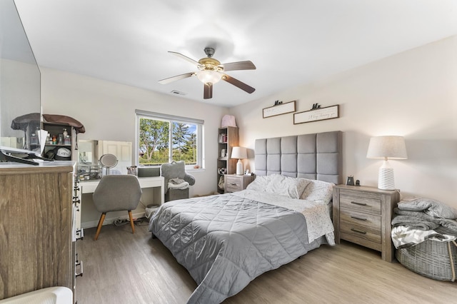 1787 W Algonquin Rd Unit 1B, Mount Prospect, IL 60056 - bedroom with wood finished floors, ceiling fan, and a desk