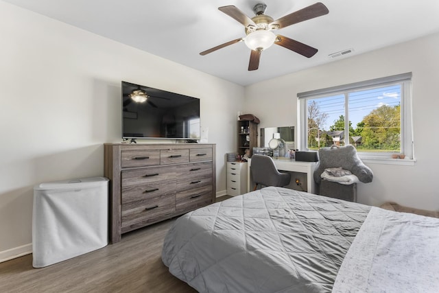 1787 W Algonquin Rd Unit 1B, Mount Prospect, IL 60056 - bedroom with wood finished floors, baseboards, and ceiling fan