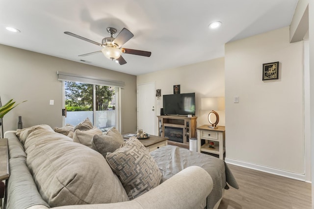 1787 W Algonquin Rd Unit 1B, Mount Prospect, IL 60056 - living area with ceiling fan, baseboards, wood finished floors, recessed lighting, and a fireplace