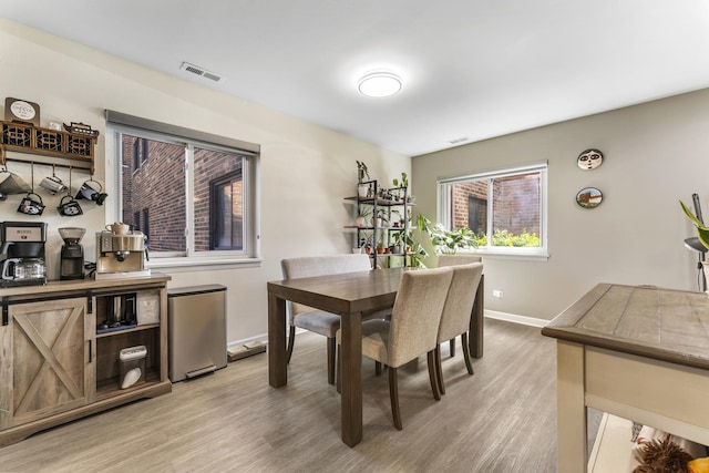 1787 W Algonquin Rd Unit 1B, Mount Prospect, IL 60056 - dining space with light wood-style floors and baseboards