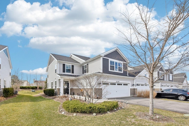 4144 Calder Ln, Aurora, IL 60504 - view of front of house featuring driveway, an attached garage, and a front yard