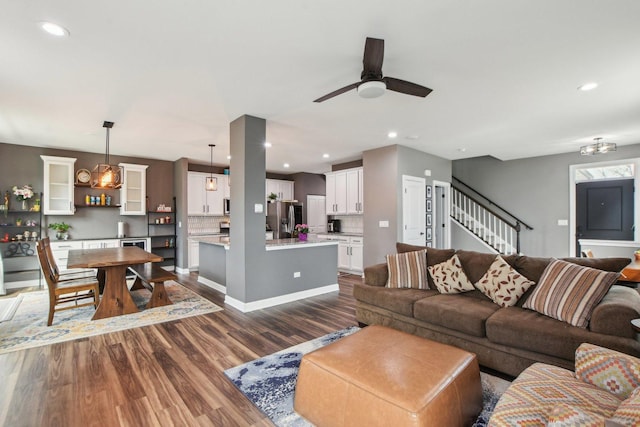 4144 Calder Ln, Aurora, IL 60504 - living room with dark wood-style floors, stairway, a ceiling fan, and recessed lighting