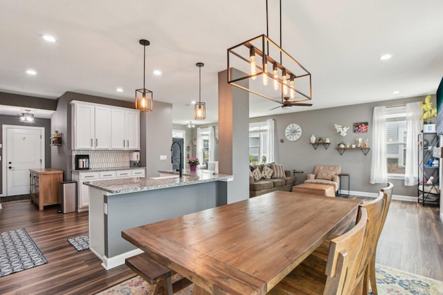 4144 Calder Ln, Aurora, IL 60504 - dining space featuring dark wood-type flooring, recessed lighting, baseboards, and a chandelier