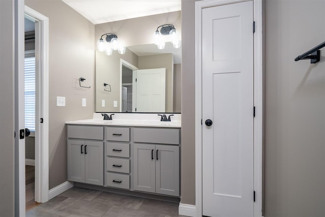 1172 Hershey Rd, Normal, IL 61761 - full bathroom featuring baseboards and double vanity