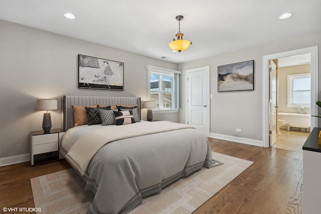 7337 N Mcvicker Ave, Chicago, IL 60646 - bedroom featuring baseboards, wood finished floors, recessed lighting, and ensuite bath