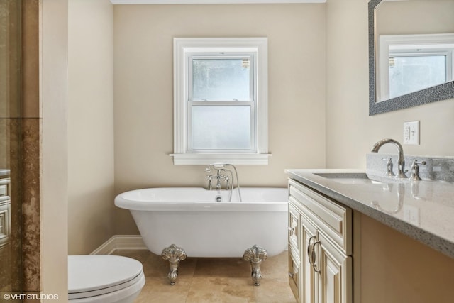 7337 N Mcvicker Ave, Chicago, IL 60646 - full bath with a freestanding tub, vanity, toilet, and tile patterned floors