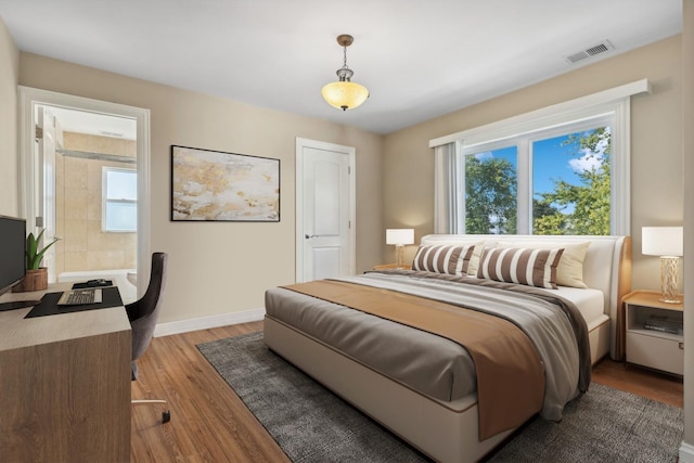 7337 N Mcvicker Ave, Chicago, IL 60646 - bedroom featuring light wood-type flooring and baseboards