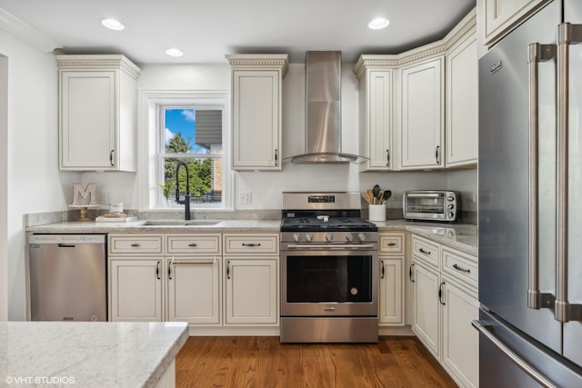 7337 N Mcvicker Ave, Chicago, IL 60646 - kitchen with stainless steel appliances, wall chimney exhaust hood, a sink, dark wood finished floors, and recessed lighting