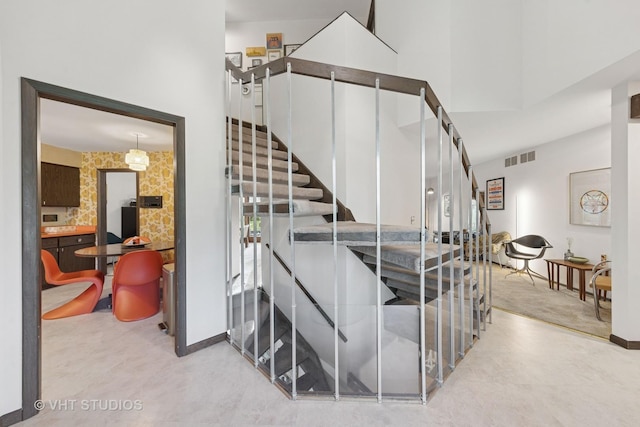 S070 River Ln, Winfield, IL 60190 - stairs with baseboards and a towering ceiling