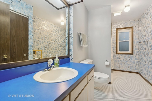S070 River Ln, Winfield, IL 60190 - bathroom featuring vanity, wallpapered walls, and toilet