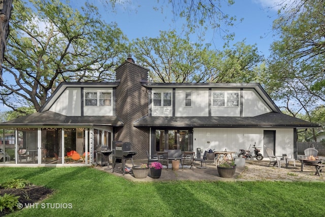 S070 River Ln, Winfield, IL 60190 - rear view of property with a patio, a yard, a chimney, and a sunroom
