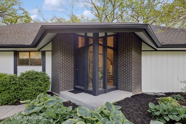 S070 River Ln, Winfield, IL 60190 - doorway to property with a shingled roof and brick siding