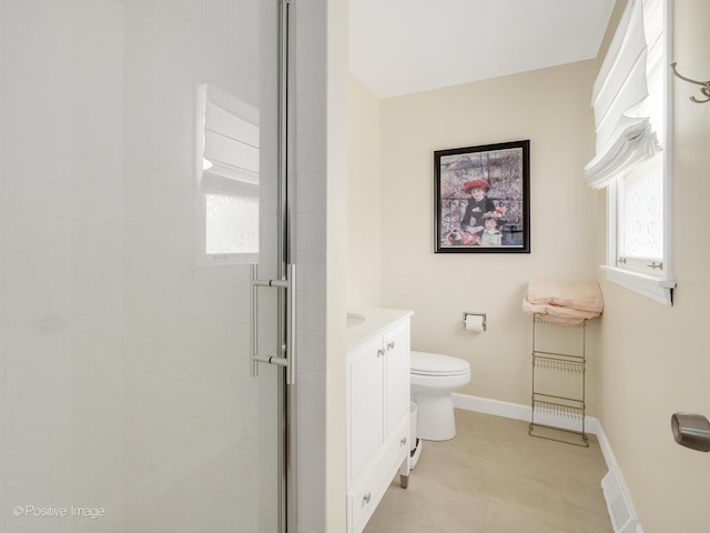 7102 Walden Ln, Darien, IL 60561 - bathroom with a shower stall, toilet, baseboards, and vanity