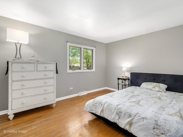 7102 Walden Ln, Darien, IL 60561 - bedroom featuring light wood finished floors and baseboards