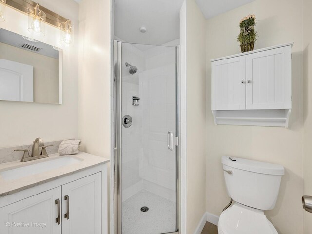 7102 Walden Ln, Darien, IL 60561 - bathroom with a shower stall, toilet, and vanity