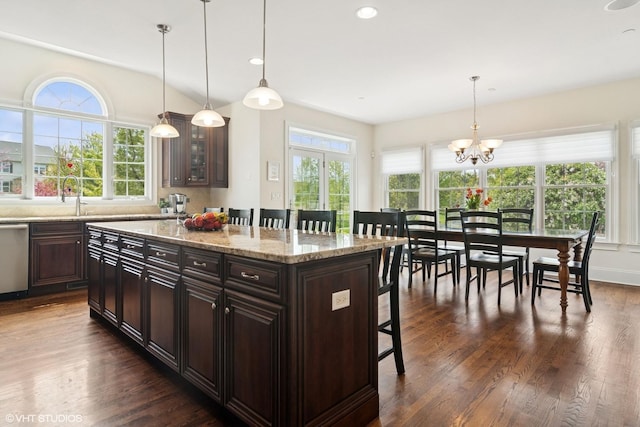 11 Crystal Downs Dr, Hawthorn Woods, IL 60047 - kitchen with a kitchen bar, dark wood-style flooring, dishwasher, a chandelier, and glass insert cabinets