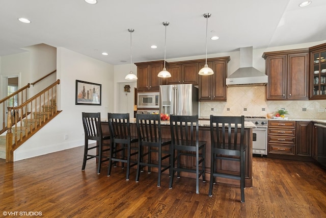 11 Crystal Downs Dr, Hawthorn Woods, IL 60047 - kitchen featuring wall chimney range hood, stainless steel appliances, dark wood-style flooring, decorative backsplash, and a center island