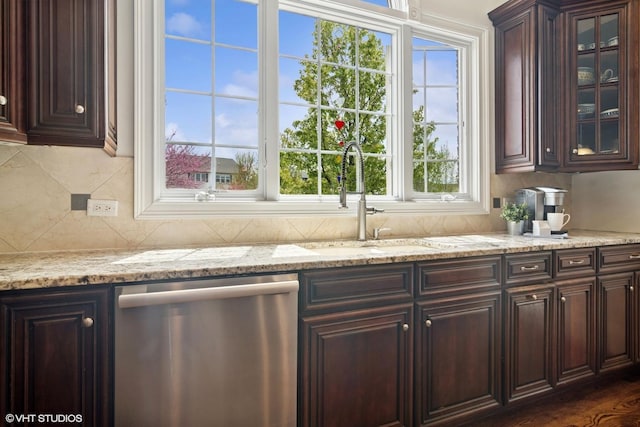 11 Crystal Downs Dr, Hawthorn Woods, IL 60047 - kitchen featuring stainless steel dishwasher, dark brown cabinets, glass insert cabinets, backsplash, and light stone countertops