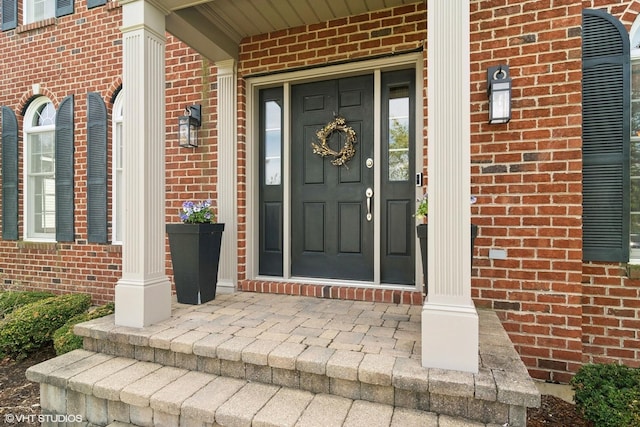 11 Crystal Downs Dr, Hawthorn Woods, IL 60047 - view of exterior entry featuring brick siding and covered porch