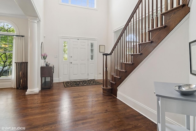 11 Crystal Downs Dr, Hawthorn Woods, IL 60047 - entrance foyer with decorative columns, wood finished floors, stairs, a high ceiling, and ornamental molding