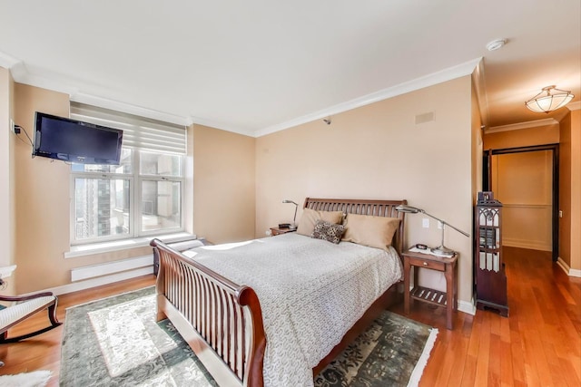 25 E Superior St Unit 2501, Chicago, IL 60611 - bedroom with ornamental molding, wood finished floors, and baseboards