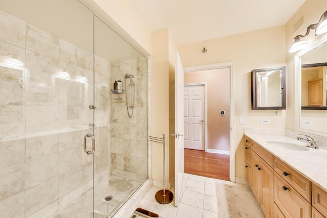 25 E Superior St Unit 2501, Chicago, IL 60611 - bathroom featuring a shower stall, vanity, tile patterned flooring, and baseboards