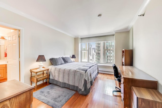 25 E Superior St Unit 2501, Chicago, IL 60611 - bedroom with crown molding, light wood finished floors, an office area, and ensuite bath