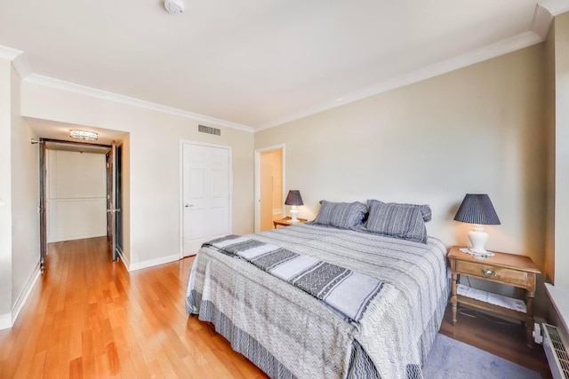 25 E Superior St Unit 2501, Chicago, IL 60611 - bedroom featuring crown molding, light wood-style floors, and baseboards