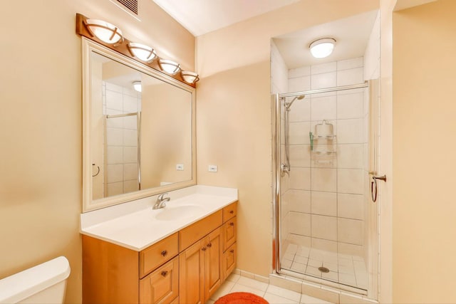 25 E Superior St Unit 2501, Chicago, IL 60611 - bathroom featuring toilet, a stall shower, vanity, and tile patterned floors
