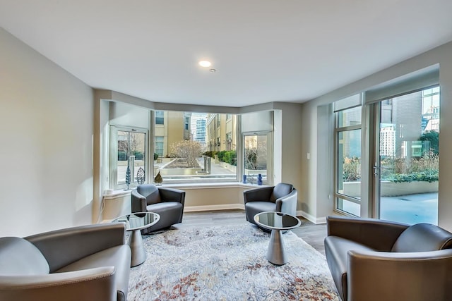 25 E Superior St Unit 2501, Chicago, IL 60611 - sitting room featuring wood finished floors, healthy amount of natural light, baseboards, and recessed lighting