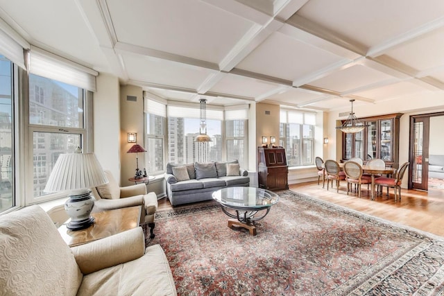 25 E Superior St Unit 2501, Chicago, IL 60611 - living room with wood finished floors, coffered ceiling, healthy amount of natural light, and beamed ceiling