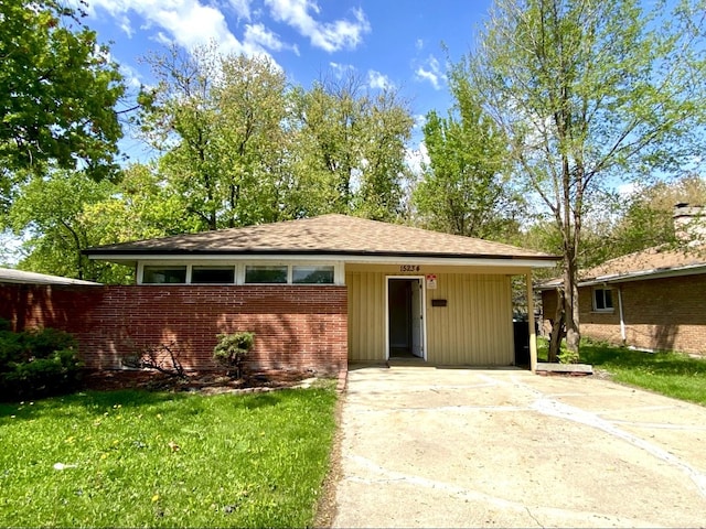 15234 Meadow Ln, Dolton, IL 60419 - view of front of property featuring driveway, brick siding, and a front yard