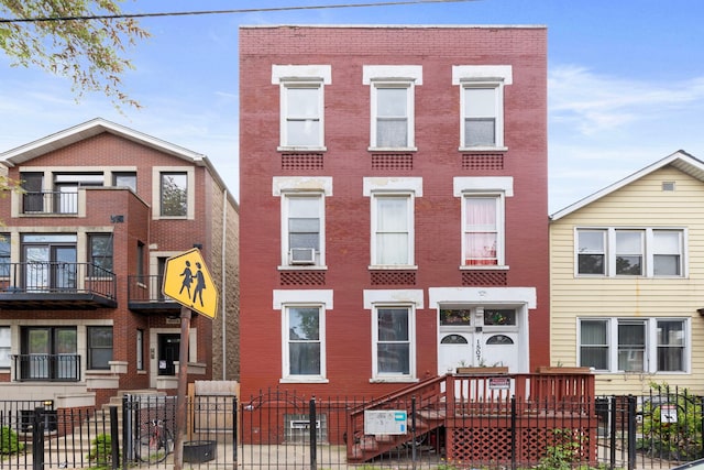 1507 W Erie St, Chicago, IL 60642 - multi unit property featuring brick siding, a fenced front yard, and cooling unit