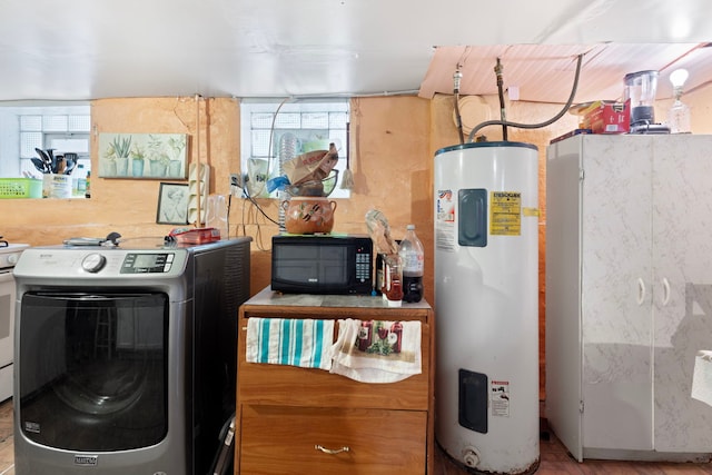 laundry room with washer / dryer, electric water heater, and plenty of natural light